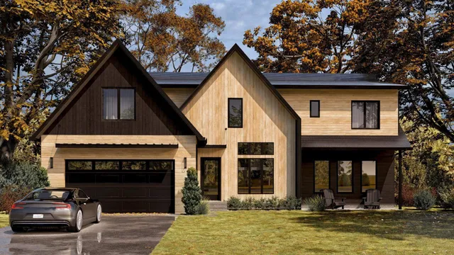 a front view of a house with a yard garage and fireplace