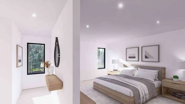 a bedroom with a bed and a large window