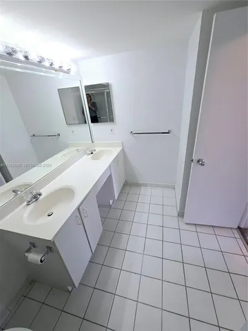 a bathroom with a sink and mirror