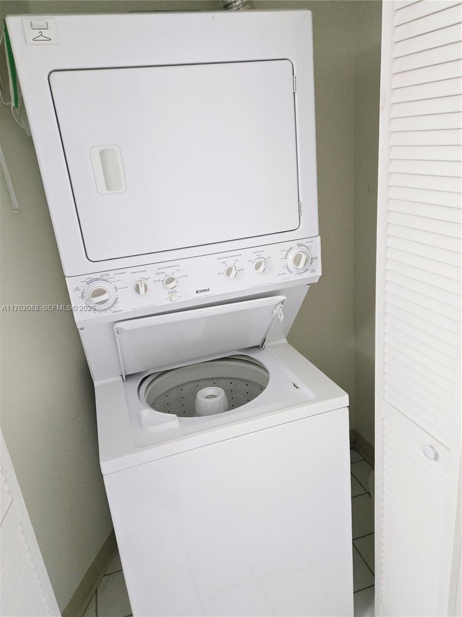 3300 Northeast 191st Street, Unit 609 Aventura, FL 33180 - Photo 14 of 16 a close up view of a washer and dryer