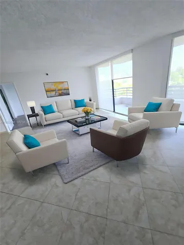 a living room with couches and a coffee table
