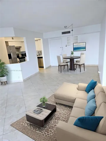 a living room with furniture and a table