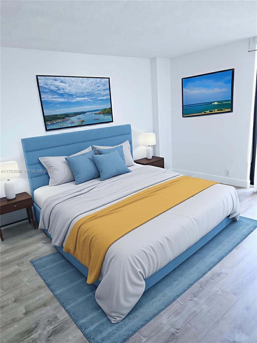 3300 Northeast 191st Street, Unit 609 Aventura, FL 33180 - Photo 8 of 16 a bedroom with a bed and painting on the wall