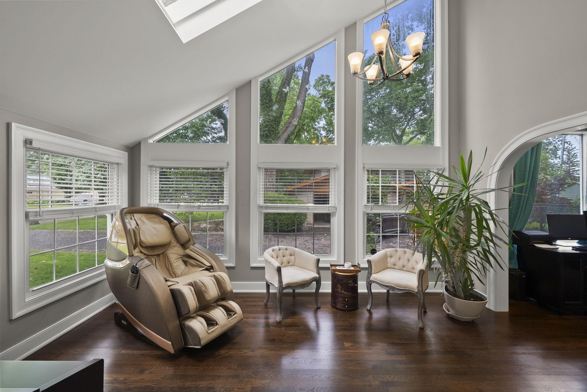 1851 Berkshire Road Columbus, OH 43221 - Photo 26 of 125 This serene flex space with vaulted ceilings and skylight, could be used as a sitting room, dining room, home retreat, really a full light flex space.