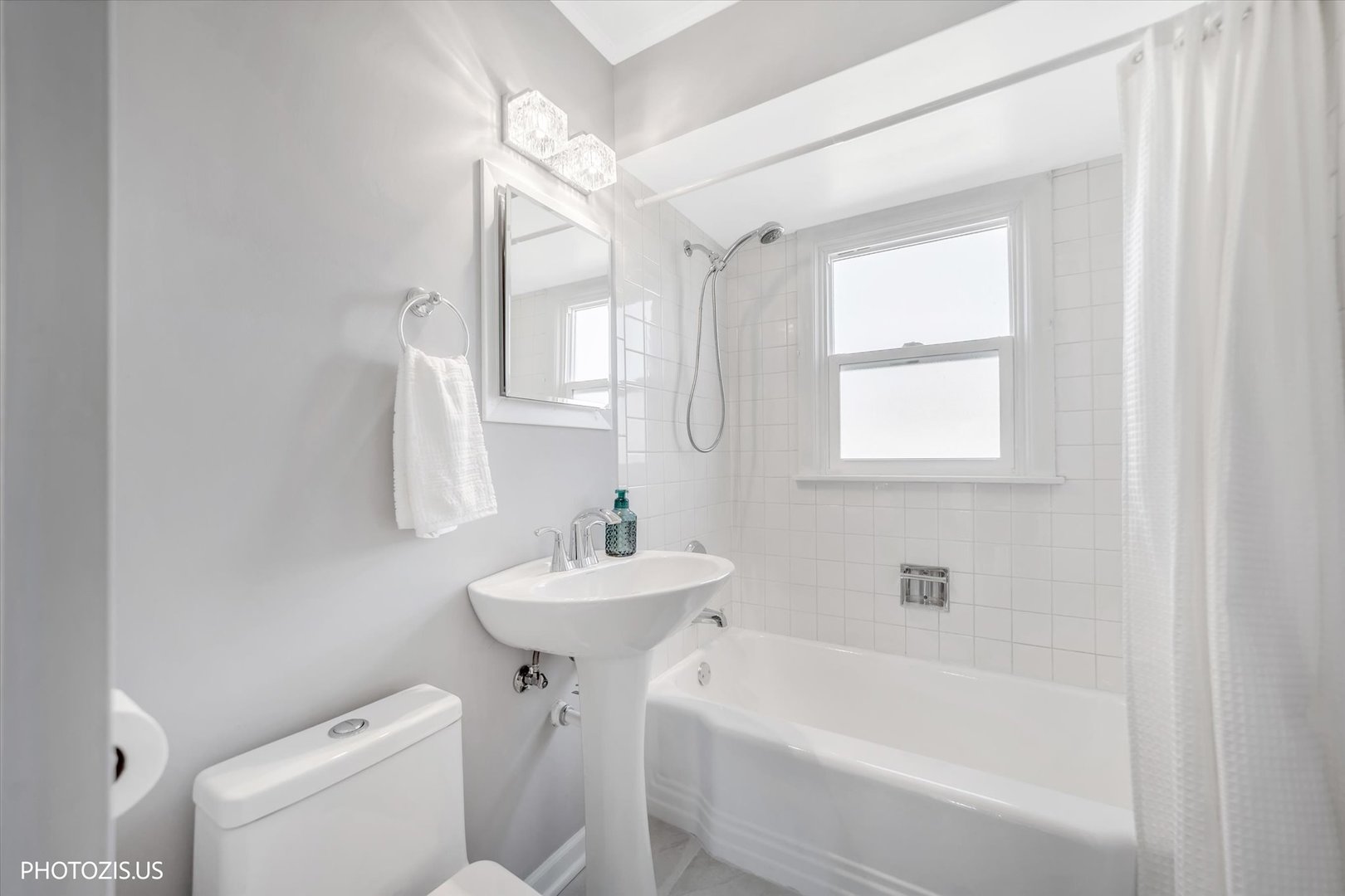 112 Pearl Street Cary, IL 60013 - Photo 13 of 25 a bathroom with a sink a toilet and shower