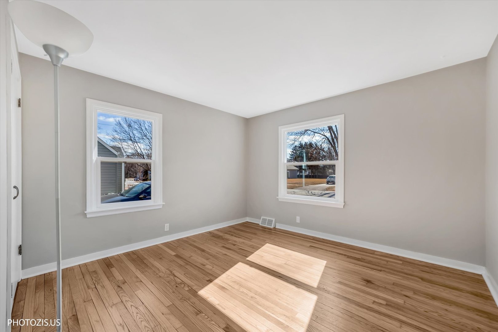112 Pearl Street Cary, IL 60013 - Photo 14 of 25 a view of a bedroom with wooden floor and window