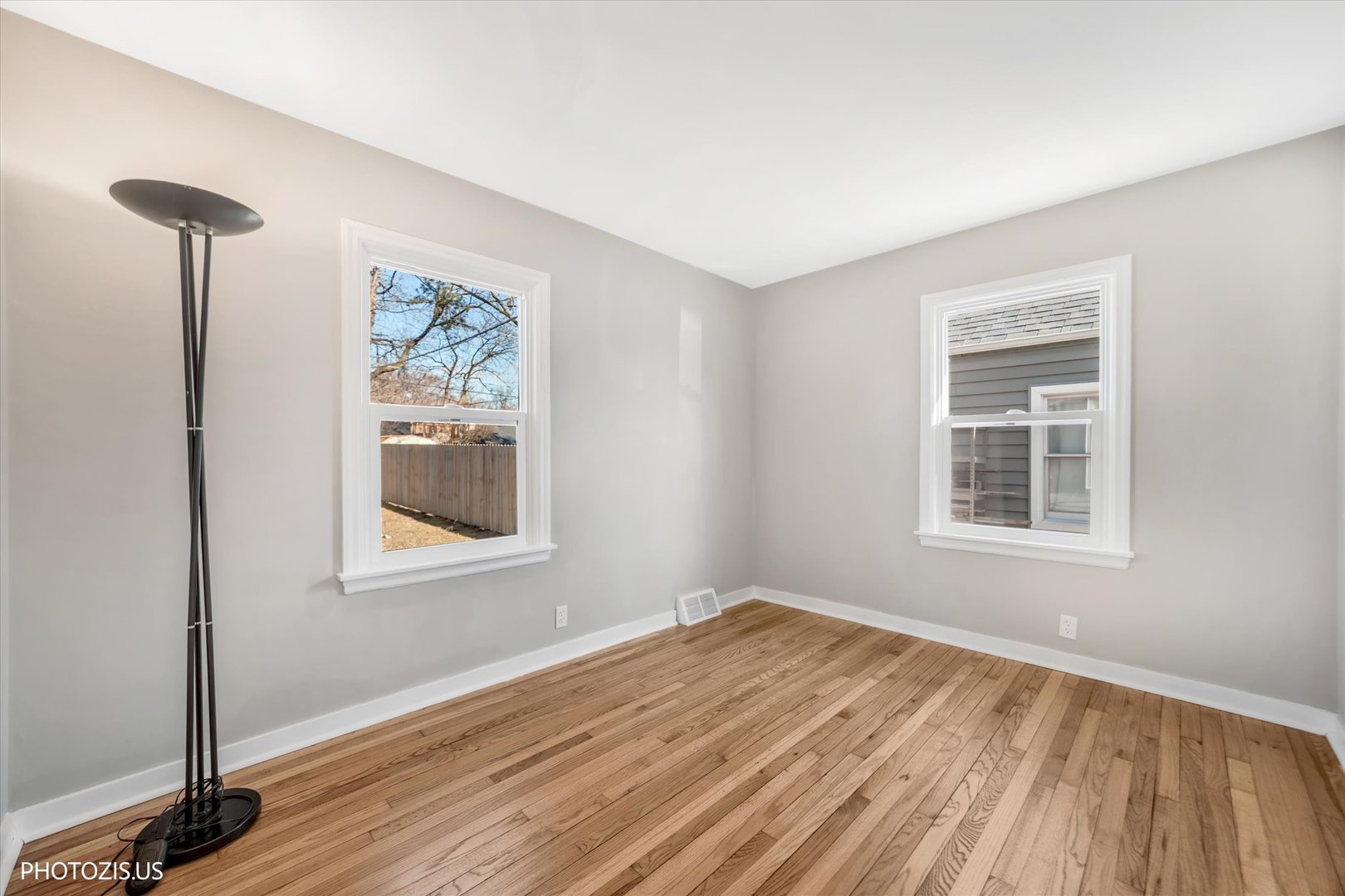 112 Pearl Street Cary, IL 60013 - Photo 15 of 25 a view of empty room with wooden floor and fan