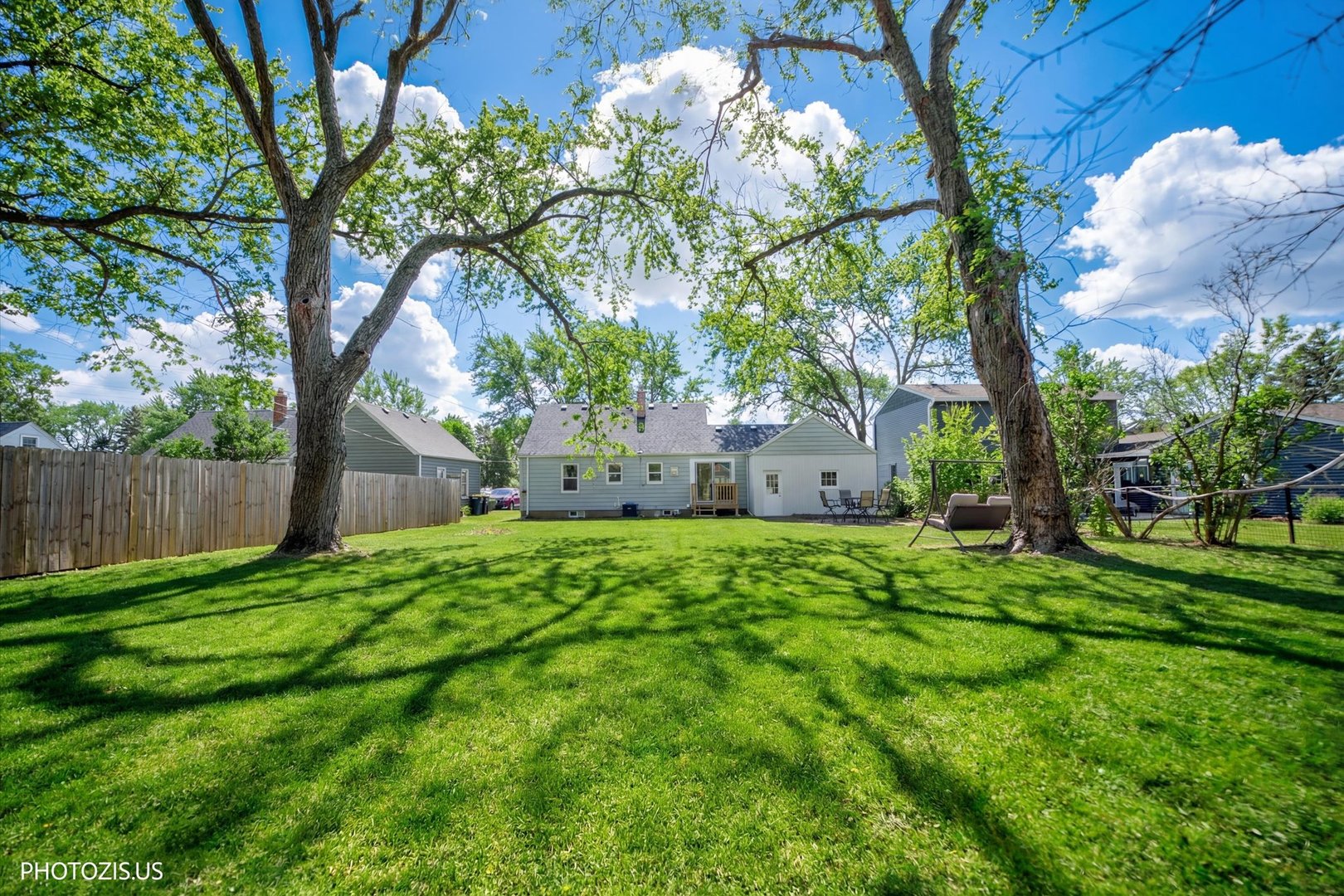 112 Pearl Street Cary, IL 60013 - Photo 24 of 25 a backyard of a house with lots of green space