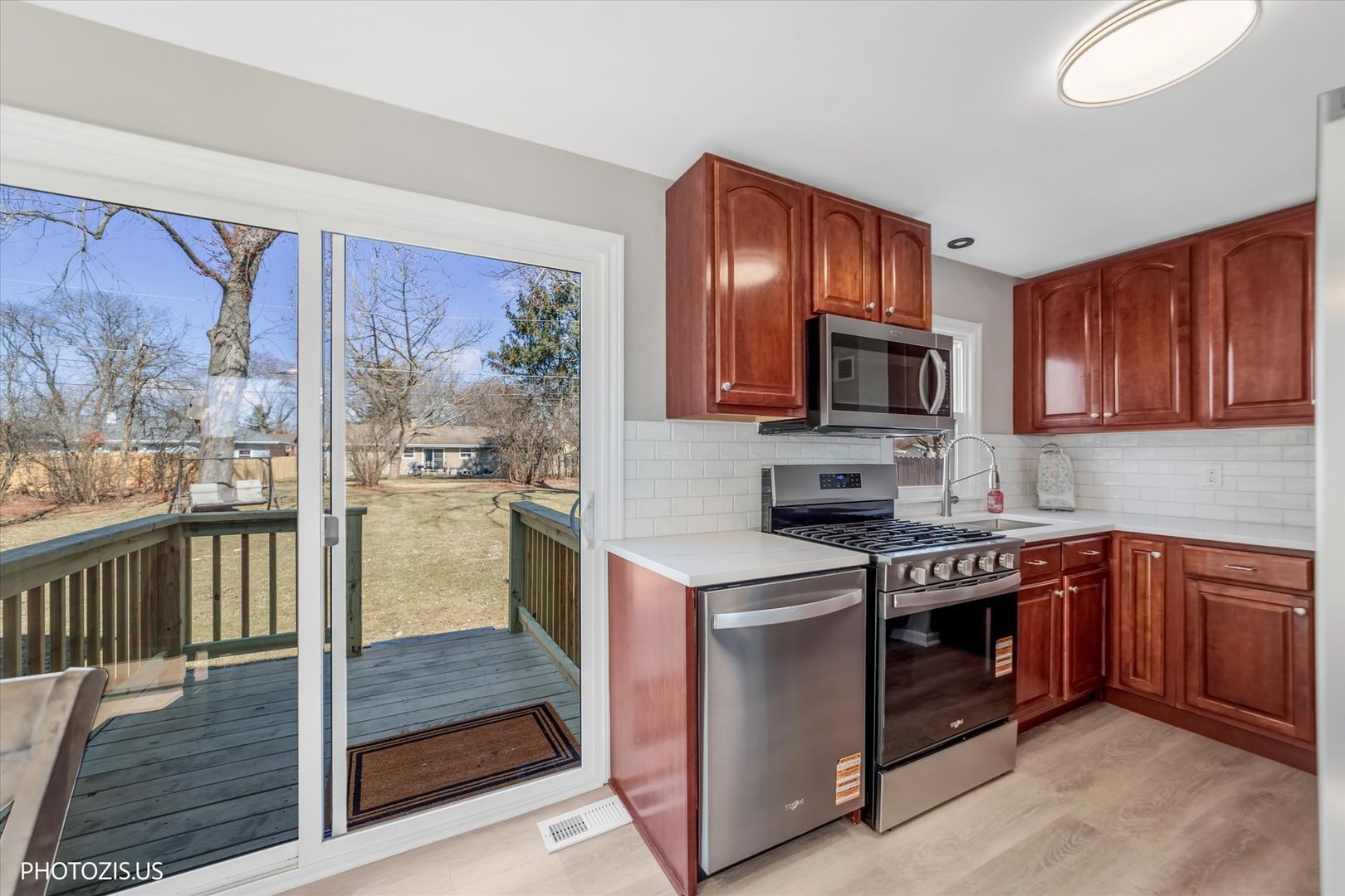 112 Pearl Street Cary, IL 60013 - Photo 6 of 25 a kitchen with stainless steel appliances granite countertop a stove top oven a sink and dishwasher
