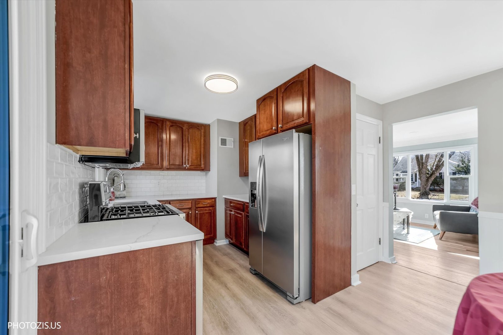 112 Pearl Street Cary, IL 60013 - Photo 8 of 25 a kitchen with stainless steel appliances granite countertop a refrigerator stove and sink