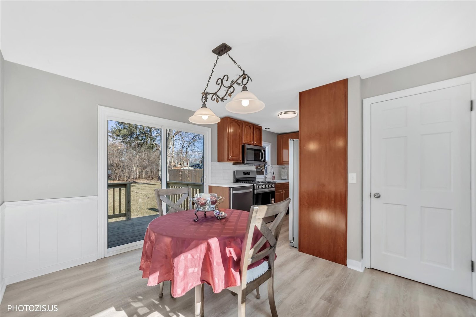 112 Pearl Street Cary, IL 60013 - Photo 10 of 25 a view of a dining room with furniture window and wooden floor