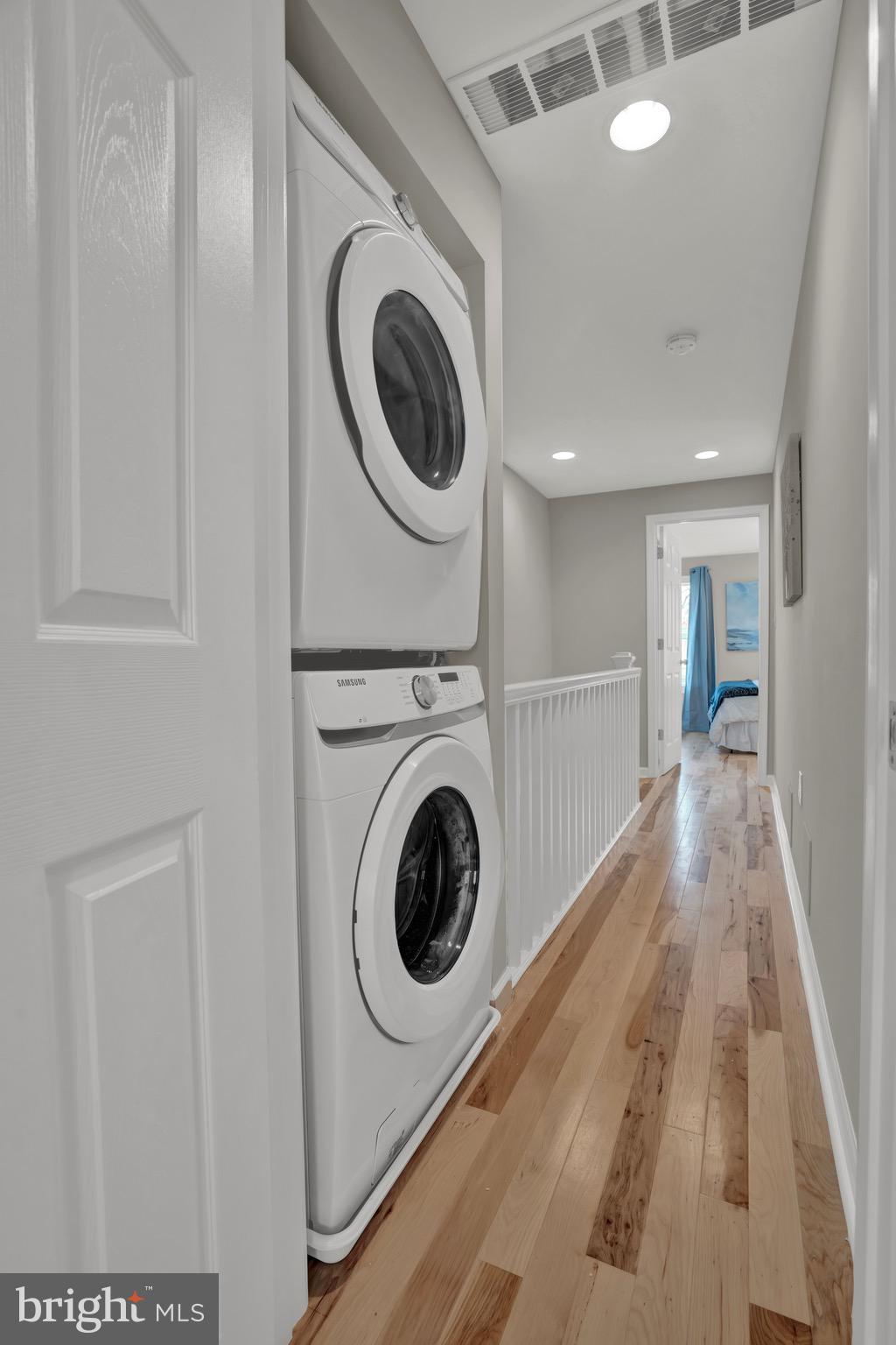 2111 East Chase Street Baltimore, MD 21213 - Photo 12 of 19 a view of a hallway with washer and dryer