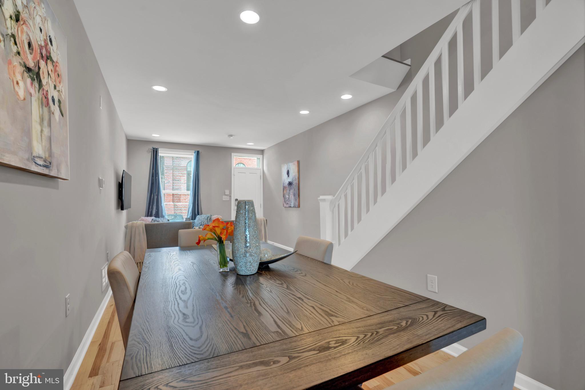 2111 East Chase Street Baltimore, MD 21213 - Photo 6 of 19 a view of entryway and hall with wooden floor