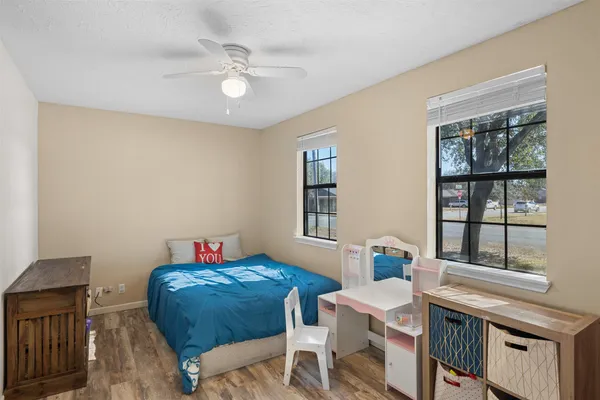 a bedroom with a bed and a table in it