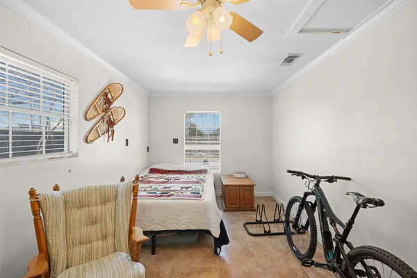 a bedroom with furniture and a window