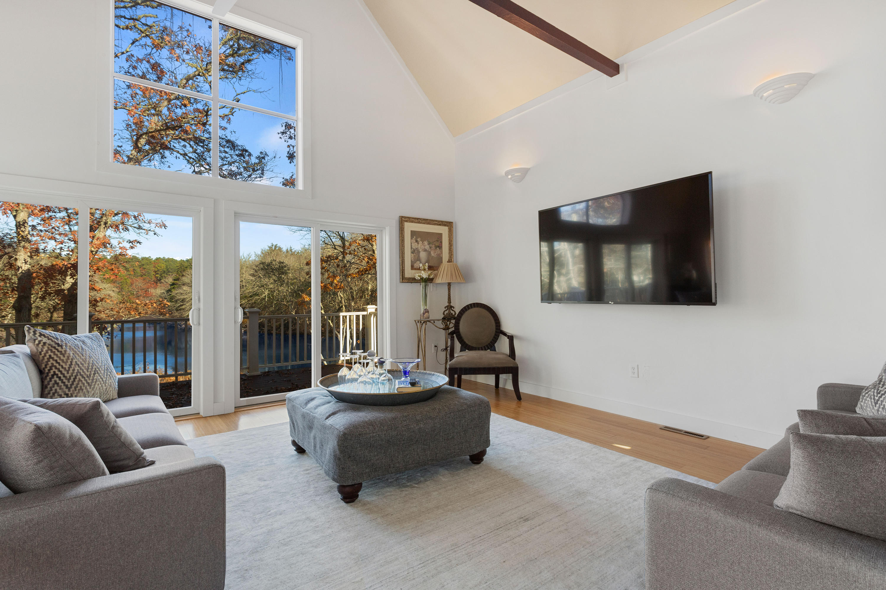 205 Uncle Percy's Road Mashpee, MA 02649 - Photo 11 of 54 a living room with furniture and a flat screen tv