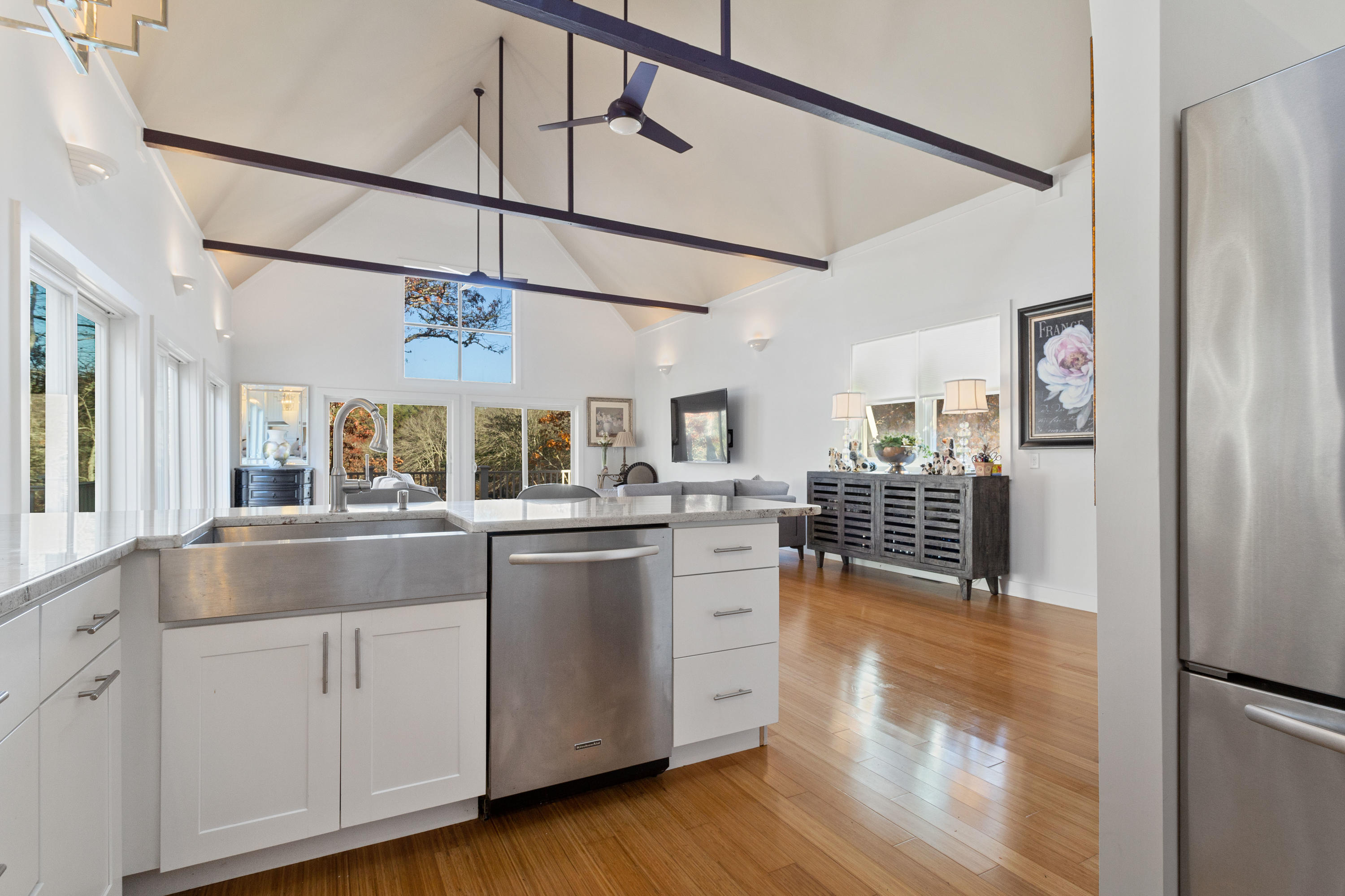205 Uncle Percy's Road Mashpee, MA 02649 - Photo 17 of 54 a kitchen with cabinets and wooden floor