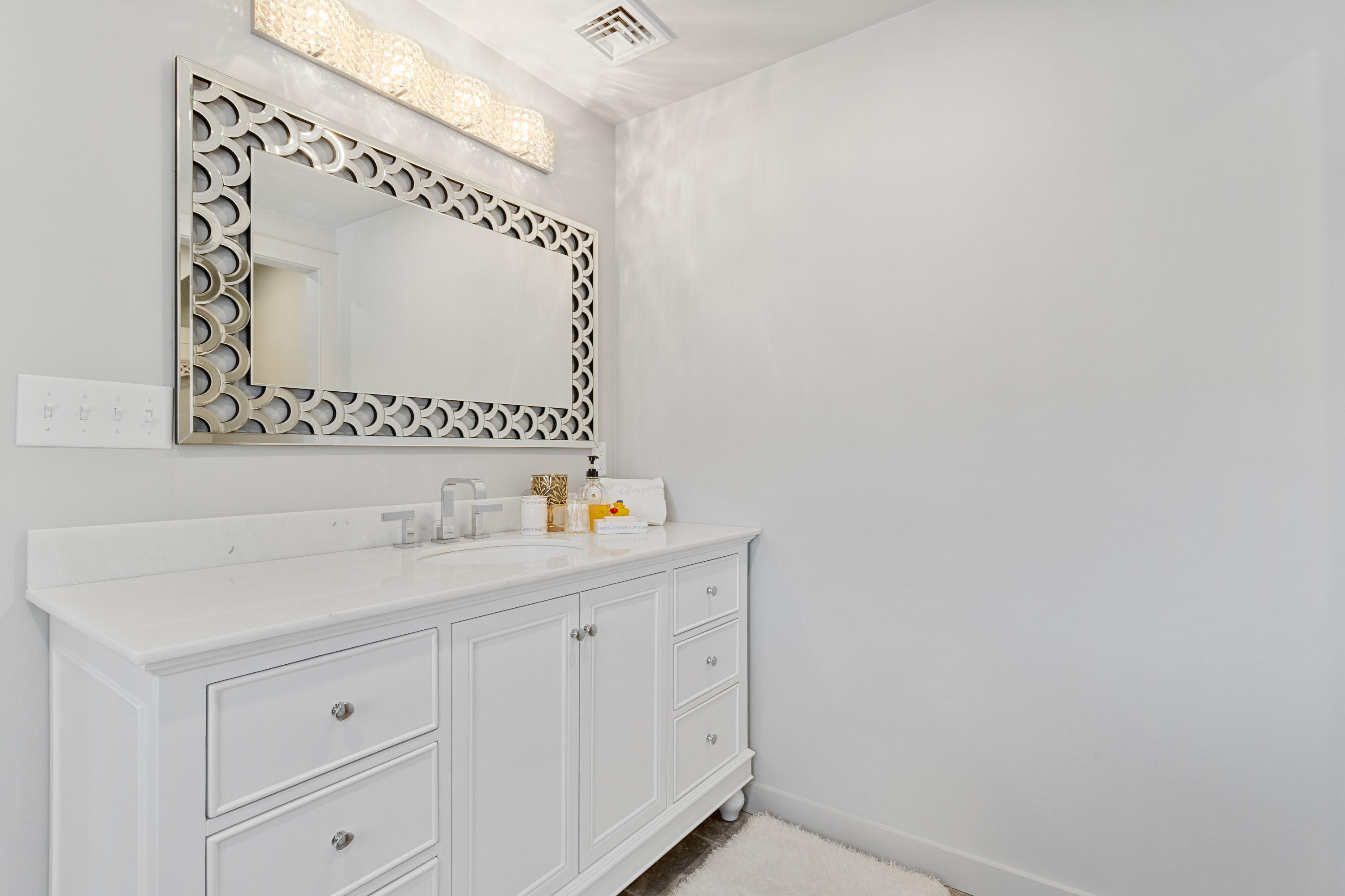205 Uncle Percy's Road Mashpee, MA 02649 - Photo 30 of 54 a bathroom with a sink and a mirror