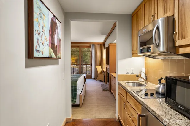 a view of a kitchen with furniture and a kitchen