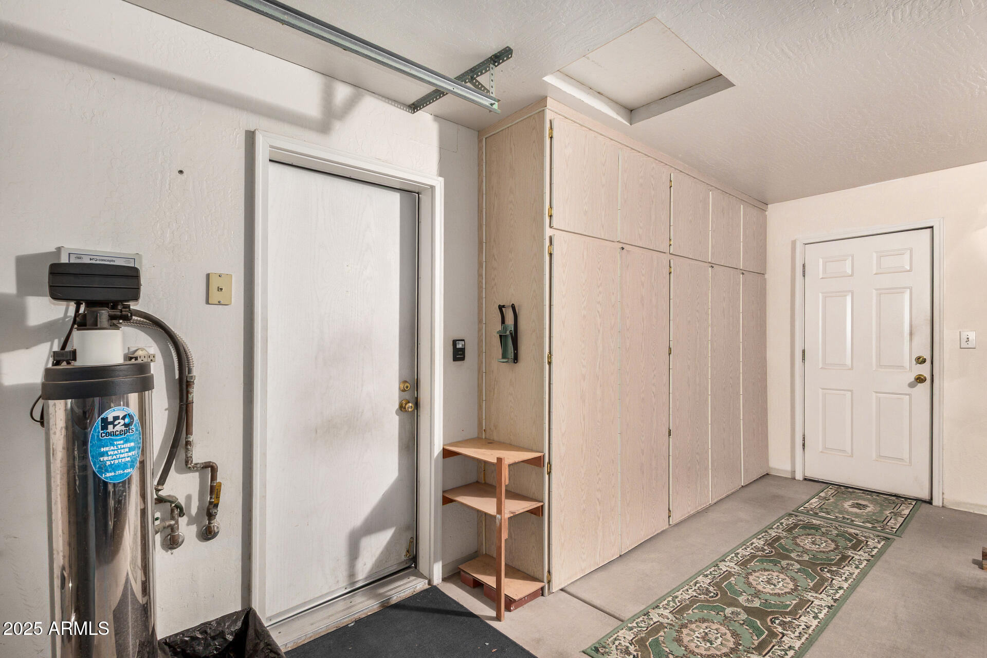 2101 South Meridian Road, Unit 27 Apache Junction, AZ 85120 - Photo 27 of 29 a view of a hallway with closet and front door