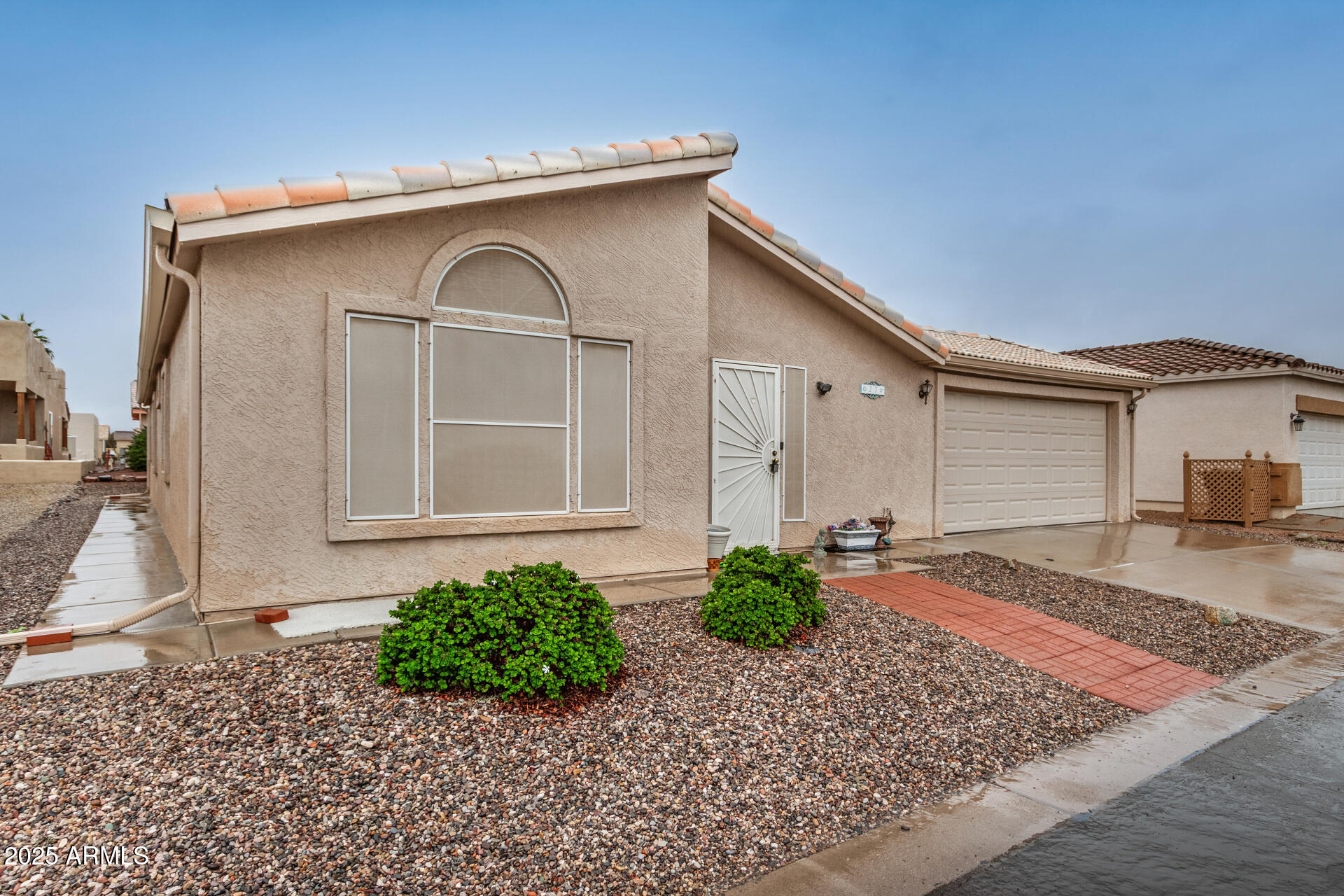 2101 South Meridian Road, Unit 27 Apache Junction, AZ 85120 - Photo 5 of 29 a front view of a house with garden