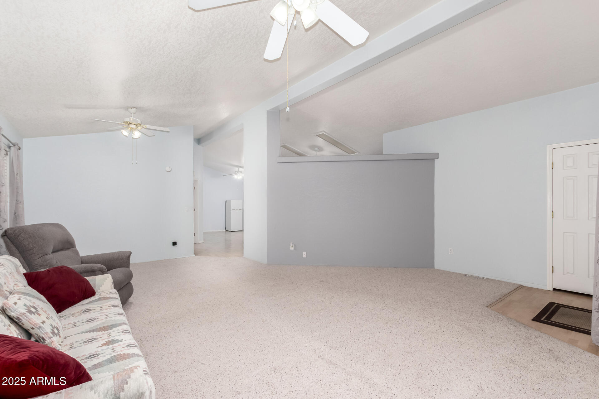 2101 South Meridian Road, Unit 27 Apache Junction, AZ 85120 - Photo 9 of 29 a living room with furniture and a large window