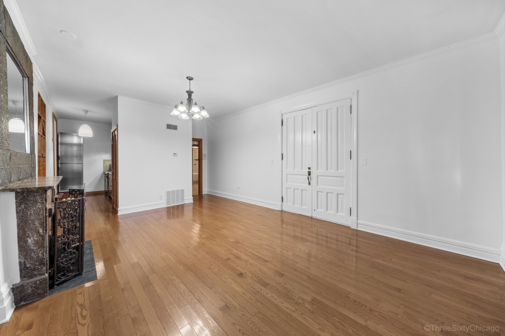 1526 North LaSalle Drive, Unit 1E Chicago, IL 60610 - Photo 2 of 17 a view of a livingroom with wooden floor