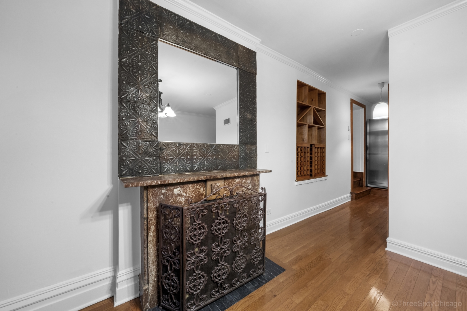 1526 North LaSalle Drive, Unit 1E Chicago, IL 60610 - Photo 6 of 17 a view of a hallway with wooden floor and staircase