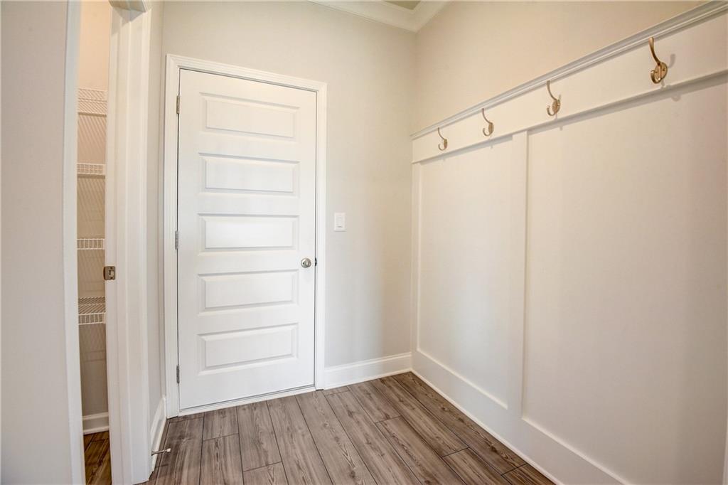 255 Wingate Drive Winder, GA 30680 - Photo 15 of 76 a view of walk in closet with empty racks