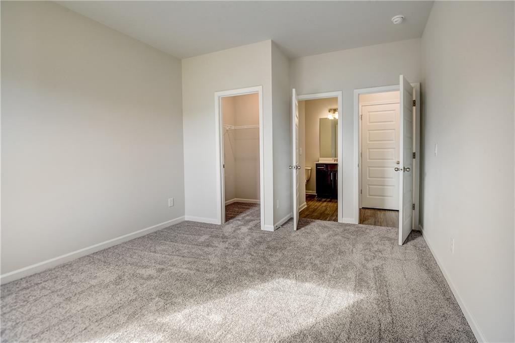 255 Wingate Drive Winder, GA 30680 - Photo 17 of 76 an empty room with closet and mirror