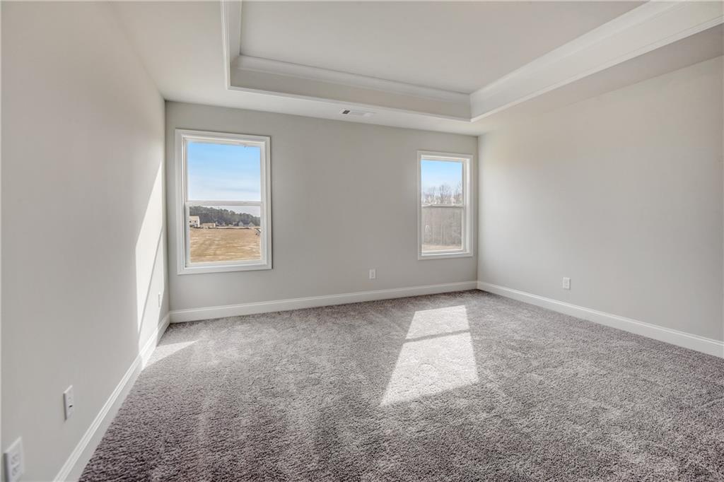 255 Wingate Drive Winder, GA 30680 - Photo 19 of 76 an empty room with windows