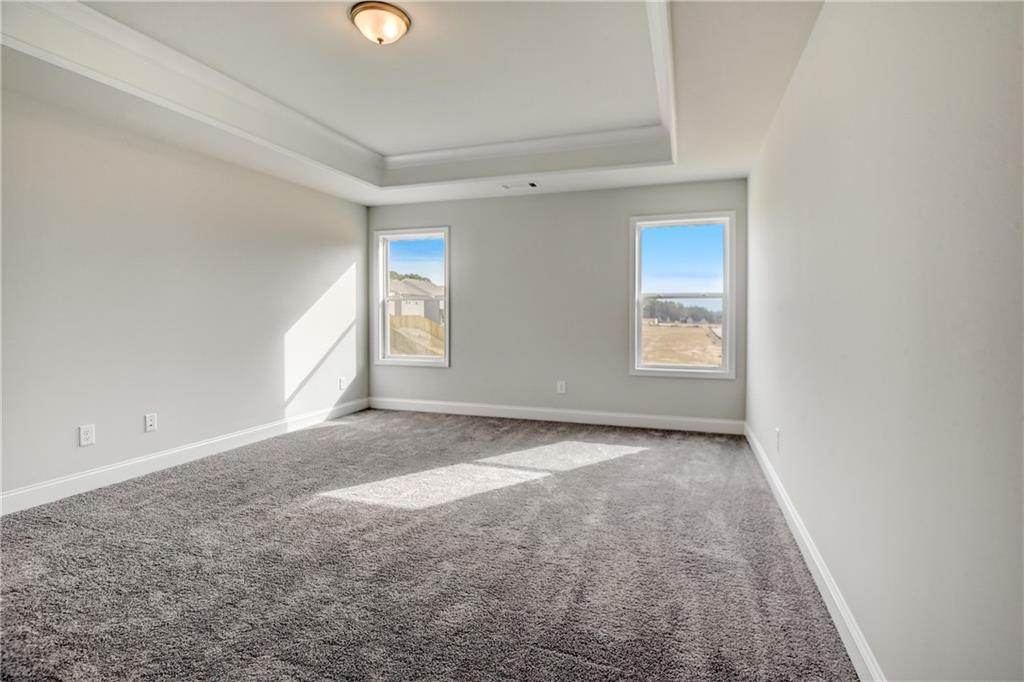 255 Wingate Drive Winder, GA 30680 - Photo 21 of 76 an empty room with windows and way to ceiling window
