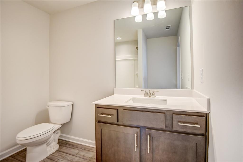 255 Wingate Drive Winder, GA 30680 - Photo 29 of 76 a bathroom with a toilet sink and mirror