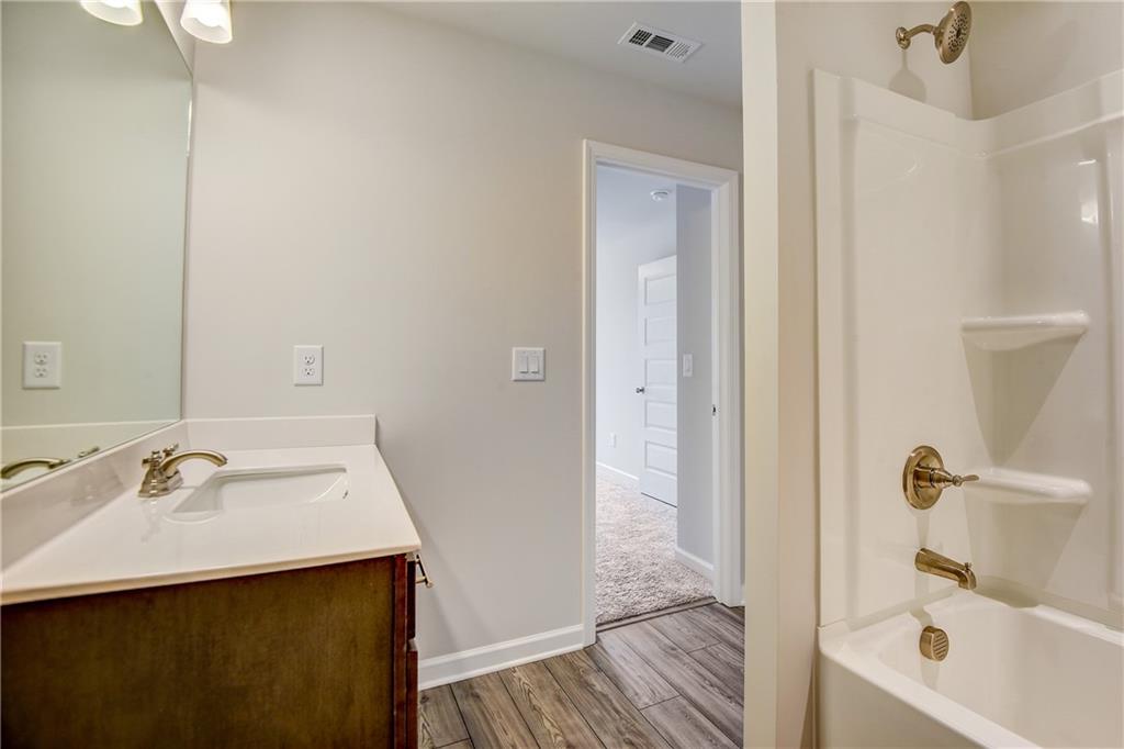 255 Wingate Drive Winder, GA 30680 - Photo 30 of 76 a bathroom with a sink and a mirror