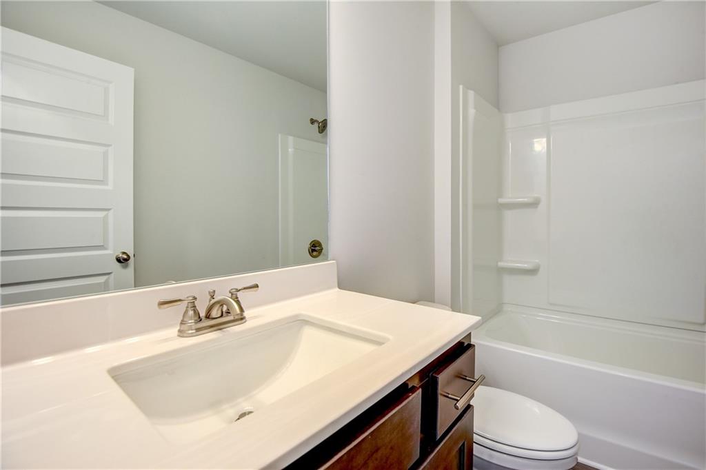 255 Wingate Drive Winder, GA 30680 - Photo 31 of 76 a bathroom with a sink and a mirror