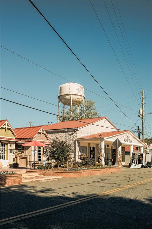 255 Wingate Drive Winder, GA 30680 - Photo 62 of 76 a view of a big building next to a road