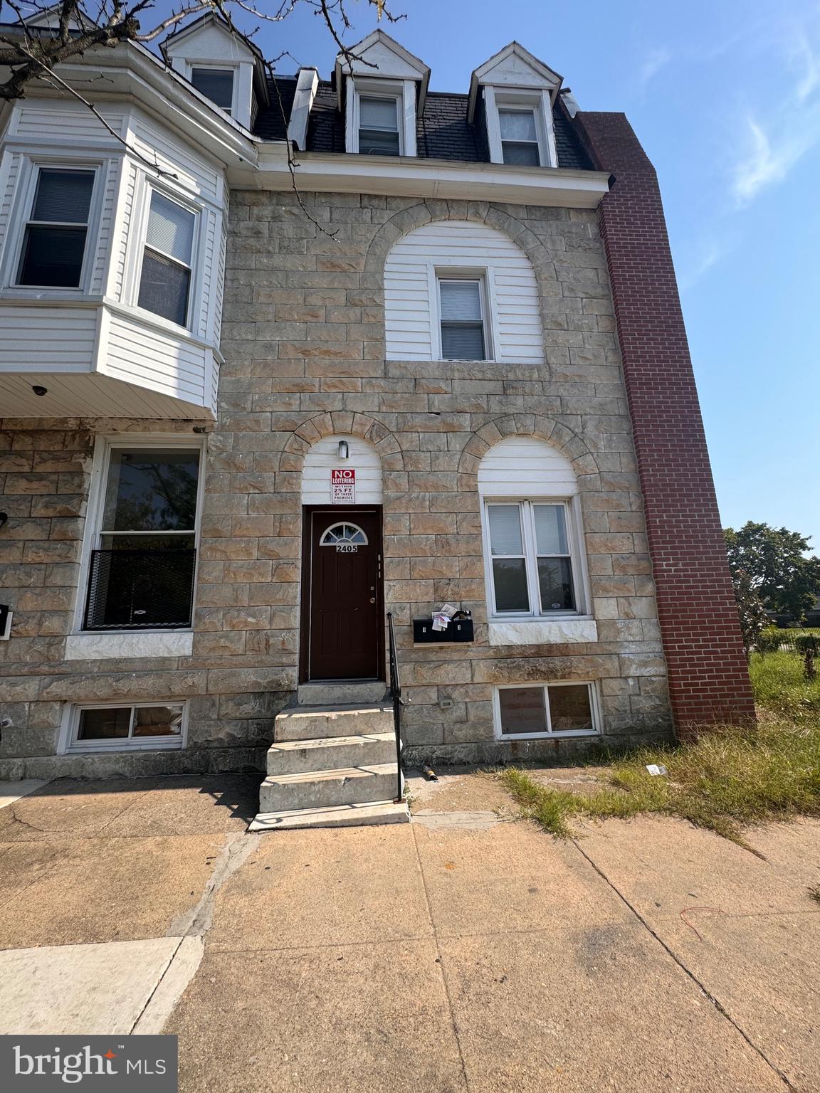 2405 Barclay Street, Unit 1 Baltimore, MD 21218 - Photo 1 of 1 a front view of a house with parking space