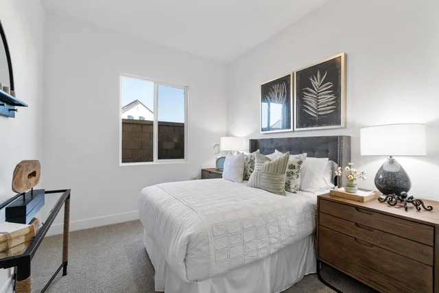 a bedroom with bed and window