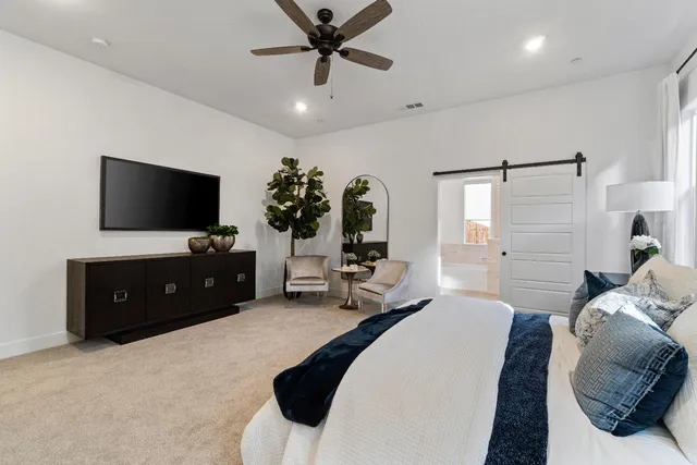 a bathroom with a granite countertop sink a mirror a bathtub and shower