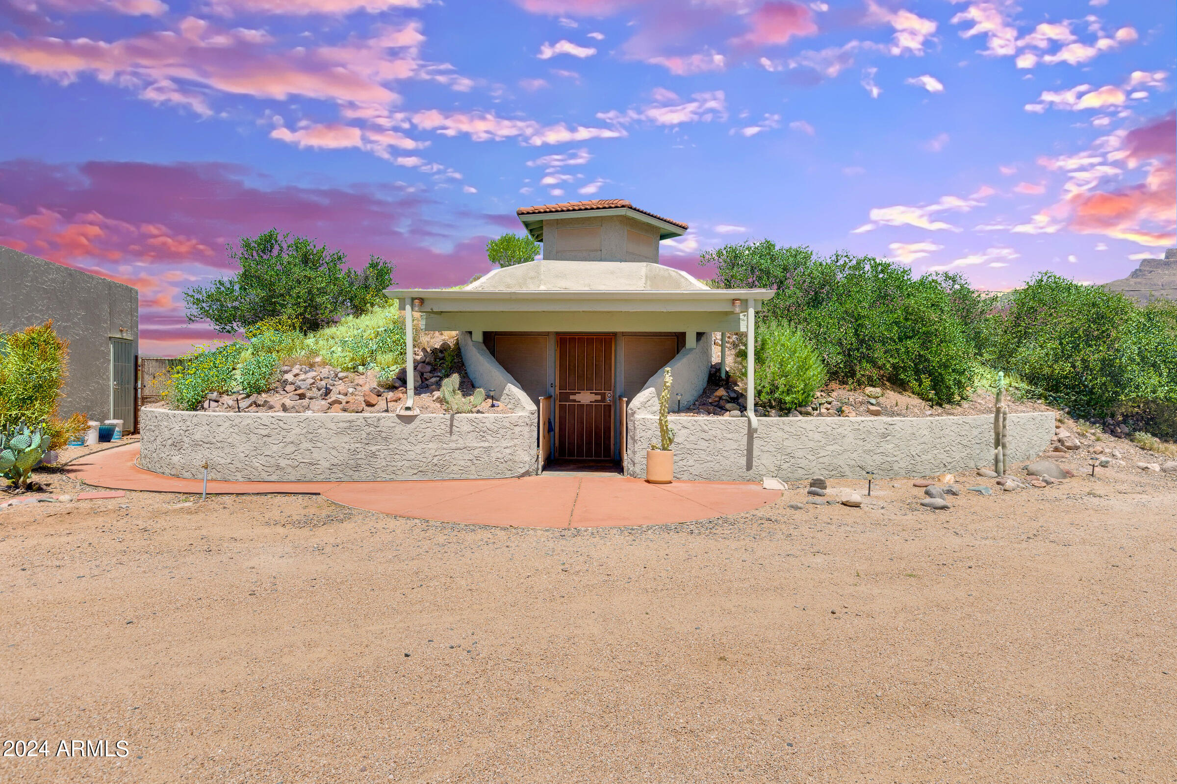 625 South Arroya Road Apache Junction, AZ 85119 - Photo 2 of 48 a front view of a house with a yard and garage