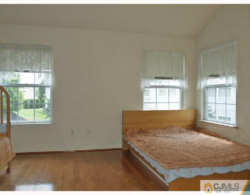 296 Pegasus Road Piscataway, NJ 08854 - Photo 8 of 10 a bedroom with a bed and window
