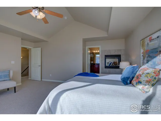 a bathroom with a granite countertop sink a large mirror and a bathtub