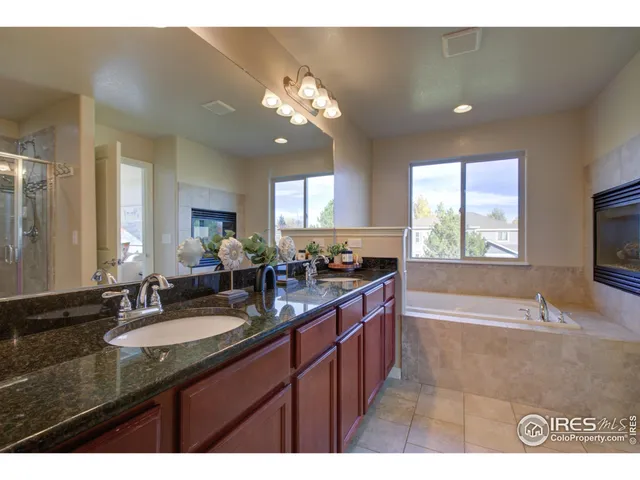 a bathroom with a shower and a tub