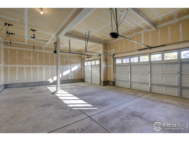 a backyard of a house with fountain and barbeque oven