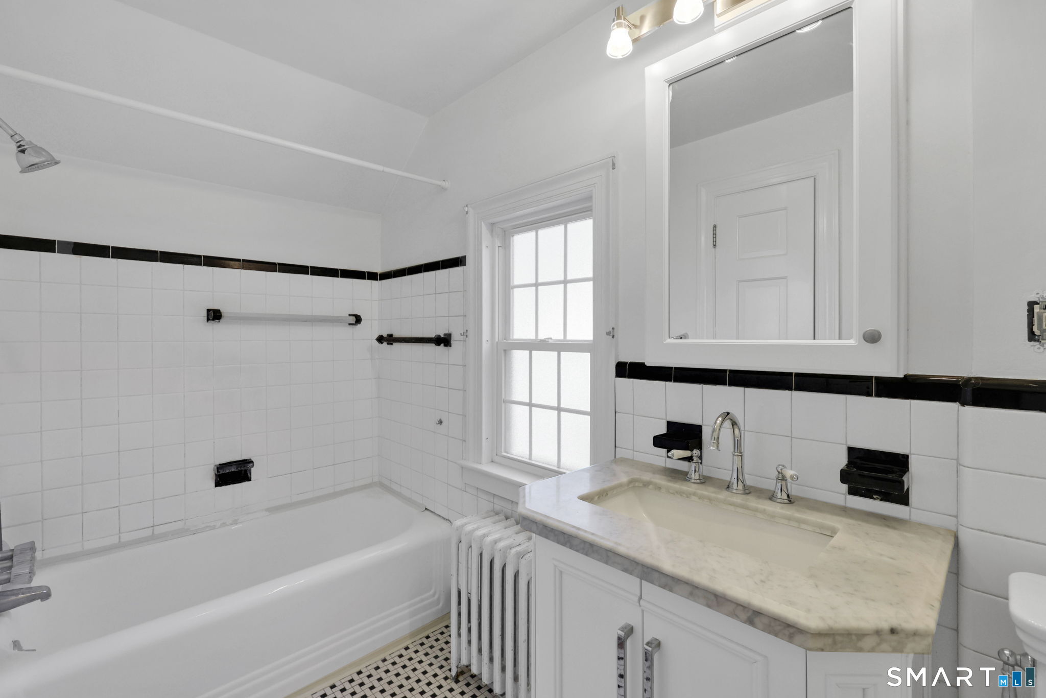 53 Alexander Street Manchester, CT 06040 - Photo 31 of 35 a bathroom with a granite countertop sink a toilet and bathtub