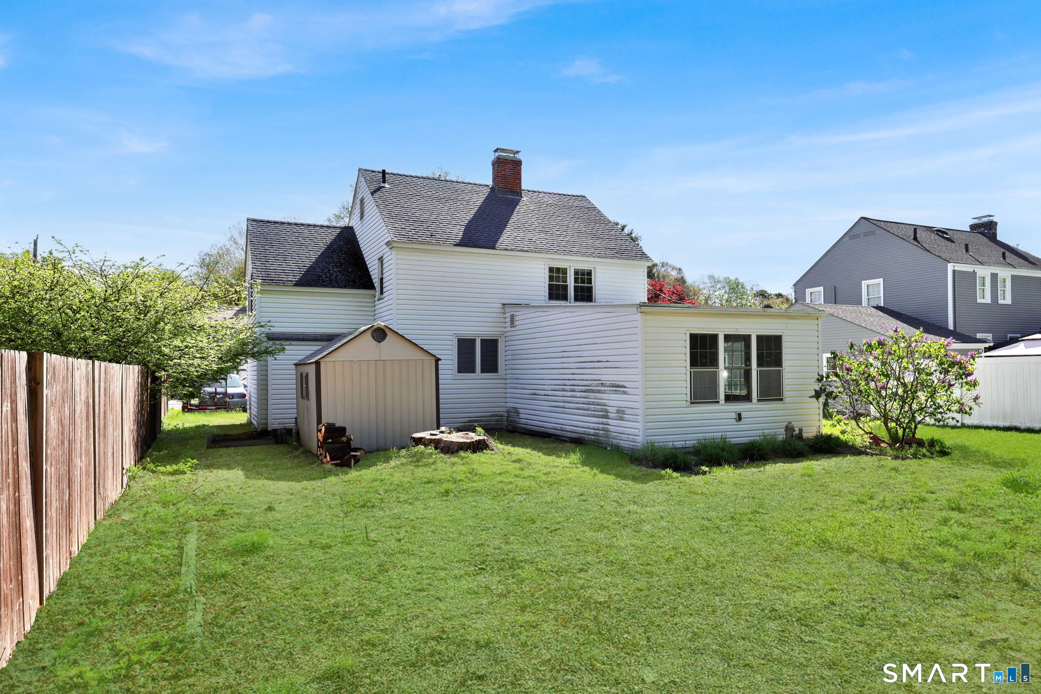 53 Alexander Street Manchester, CT 06040 - Photo 34 of 35 a front view of a house with a yard and trees