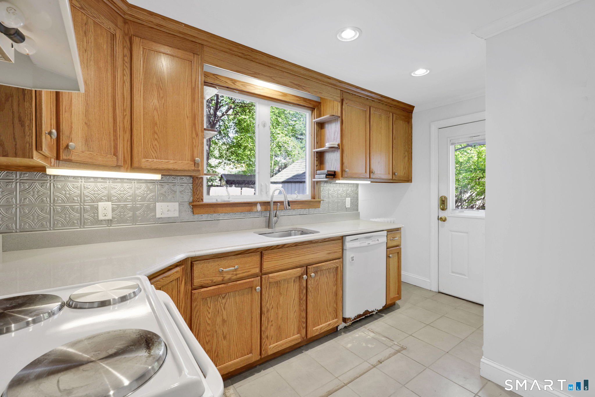 53 Alexander Street Manchester, CT 06040 - Photo 6 of 35 a kitchen with a sink window and cabinets