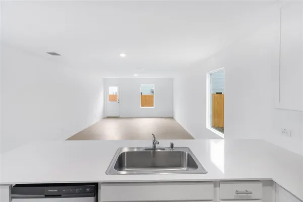 a view of kitchen sink and window
