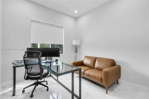 a work room with furniture and a window