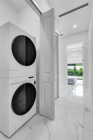 a view of a hallway with washer and dryer